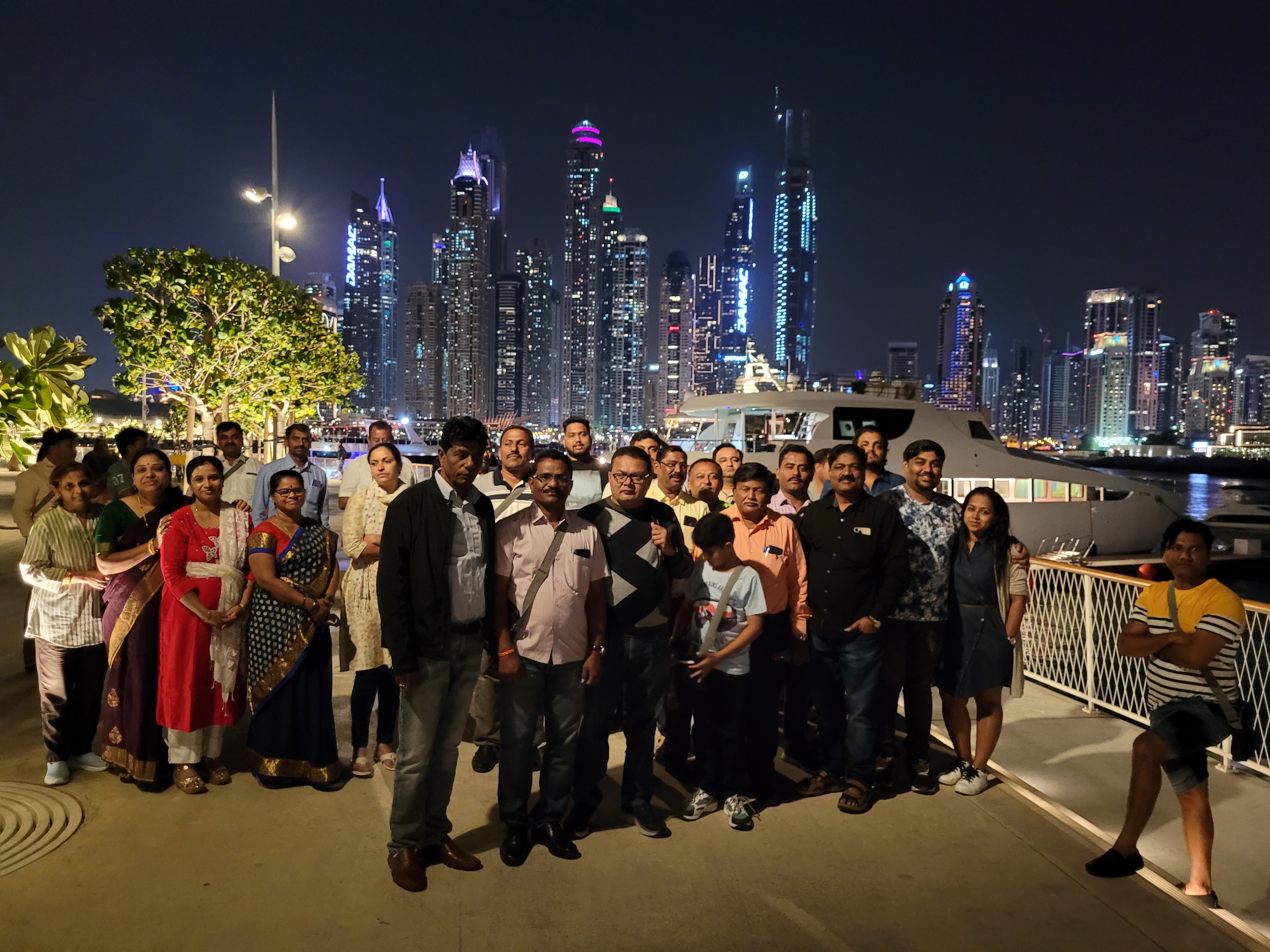 50 pax tractor distributor group at Dubai Marina waterfront at night