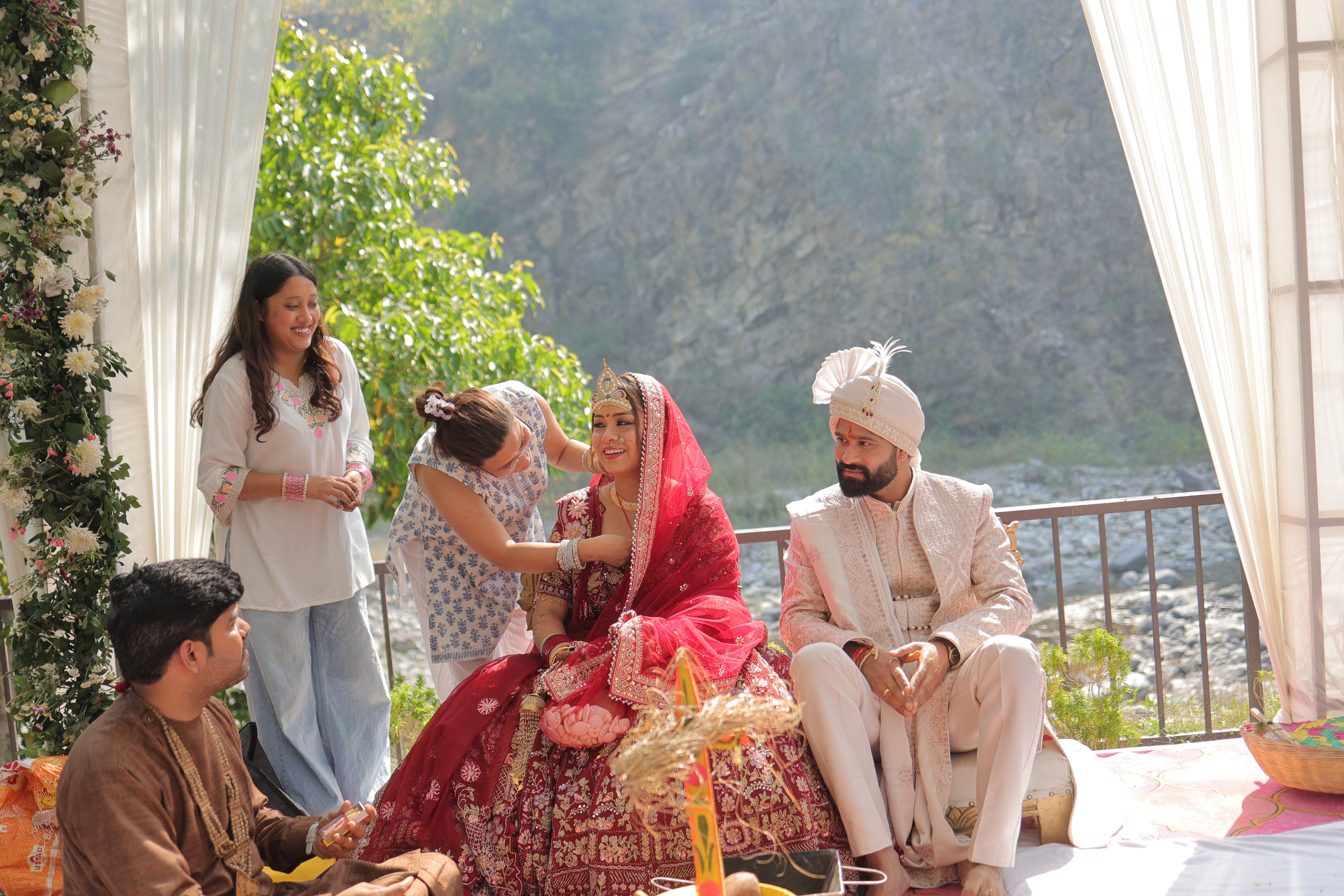 Intimate destination wedding ceremony at Jim Corbett with mountain river backdrop