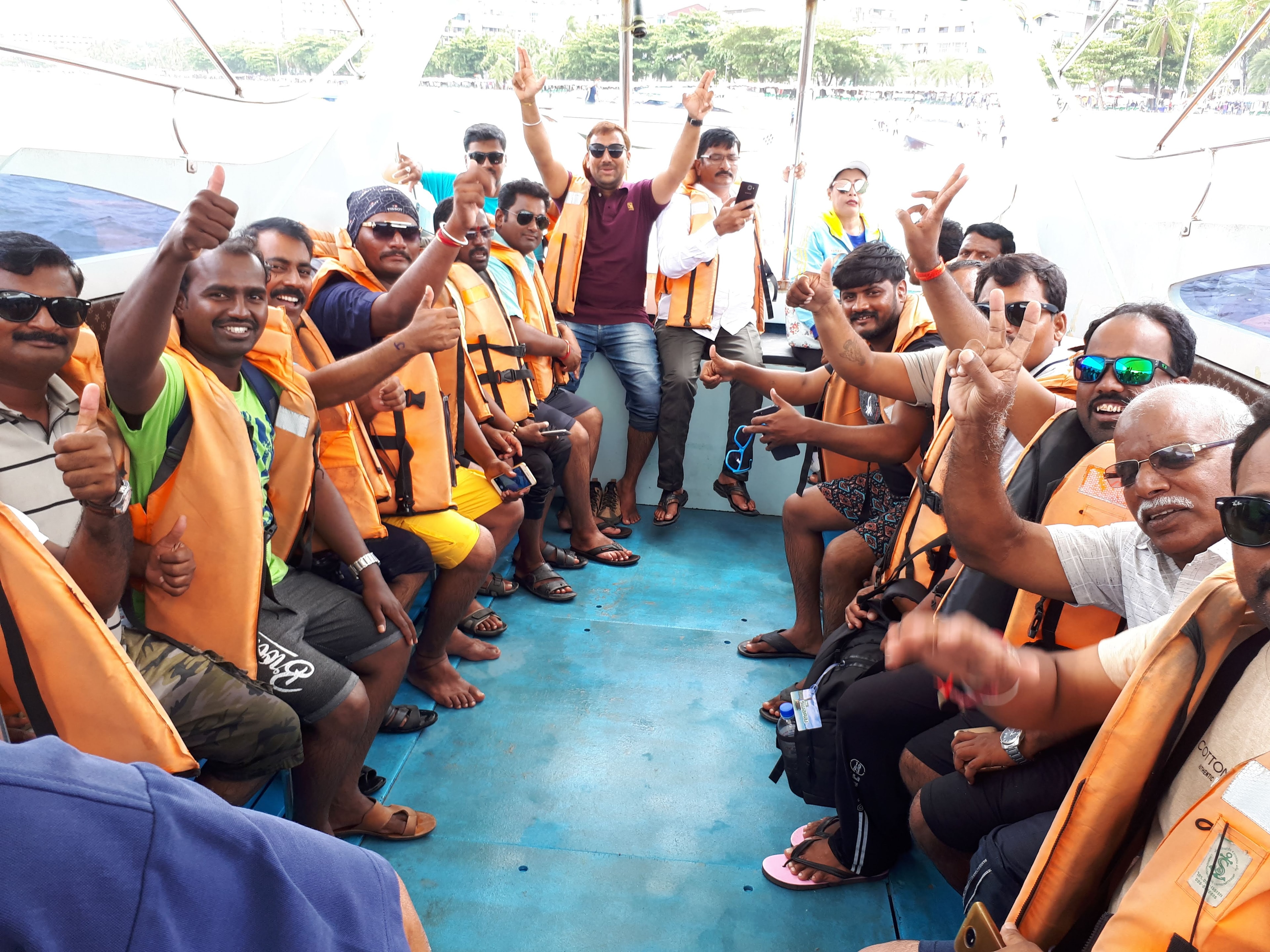 40 pax sales team incentive group on a boat in Pattaya wearing orange life jackets