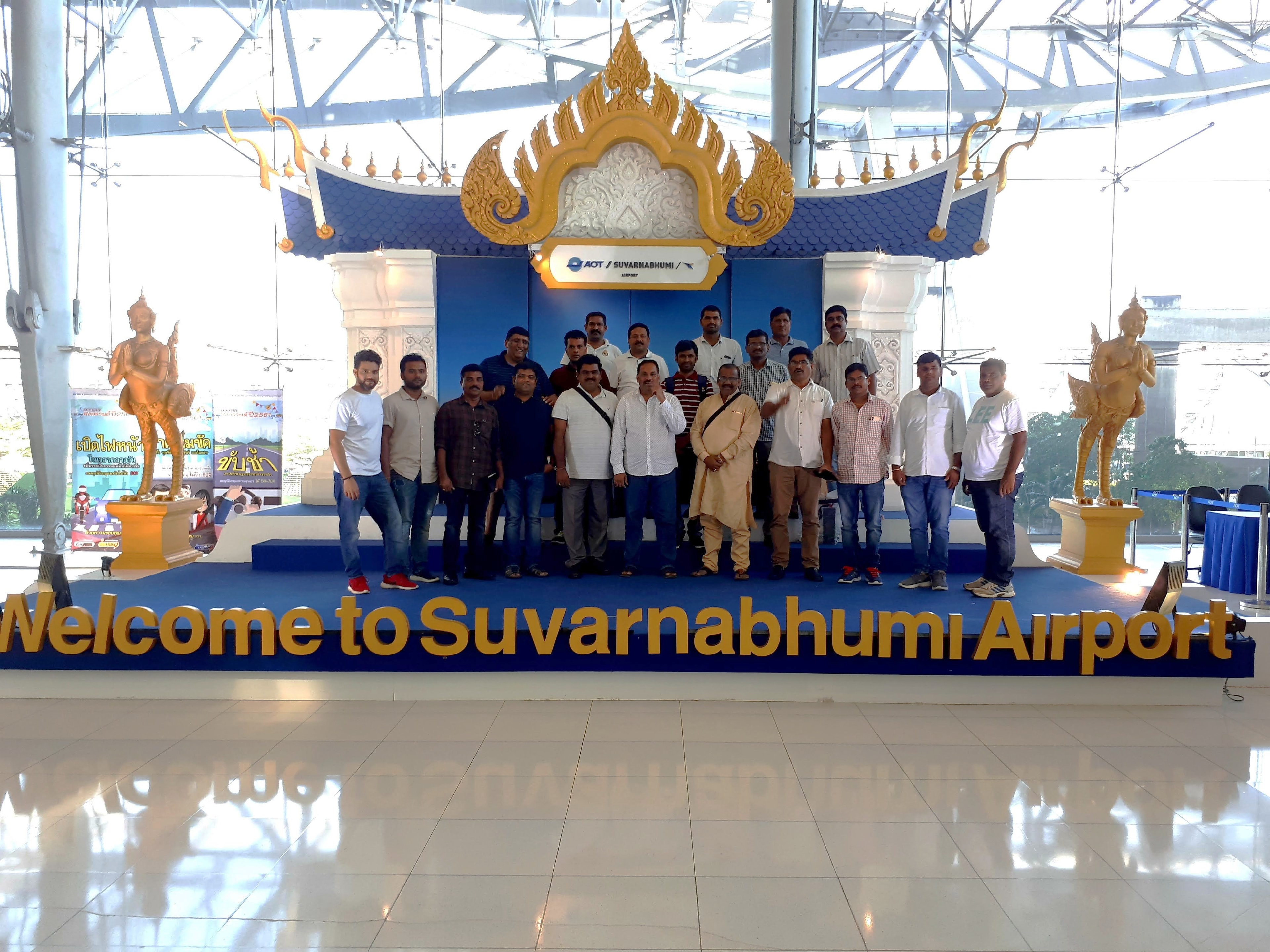 30 pax tractor distributor group at the iconic Welcome to Suvarnabhumi Airport landmark, Thailand